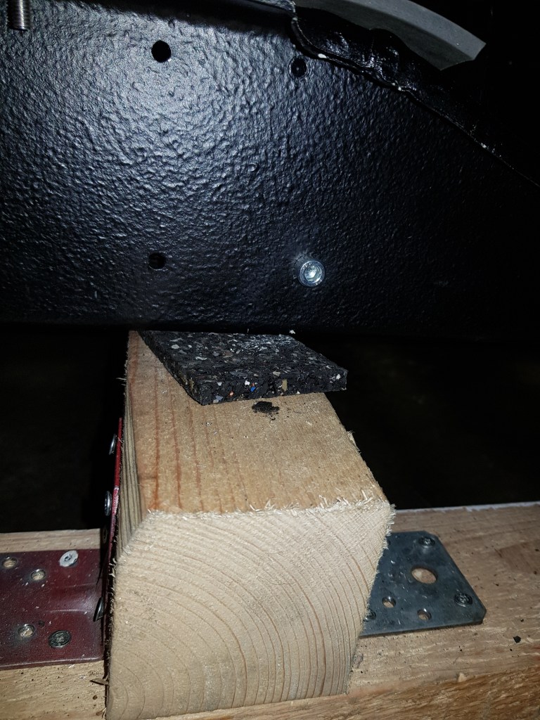 The lower rear existing drill hole was used.