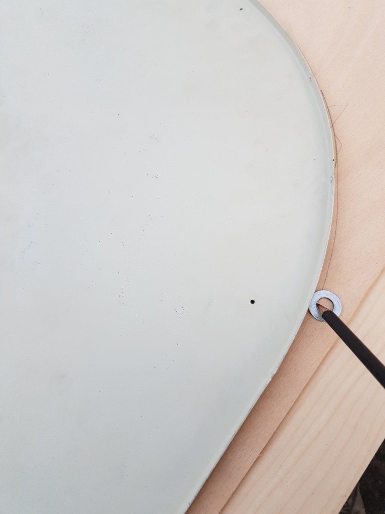 using a pencil and the washer to transfer the outline plus a few mill