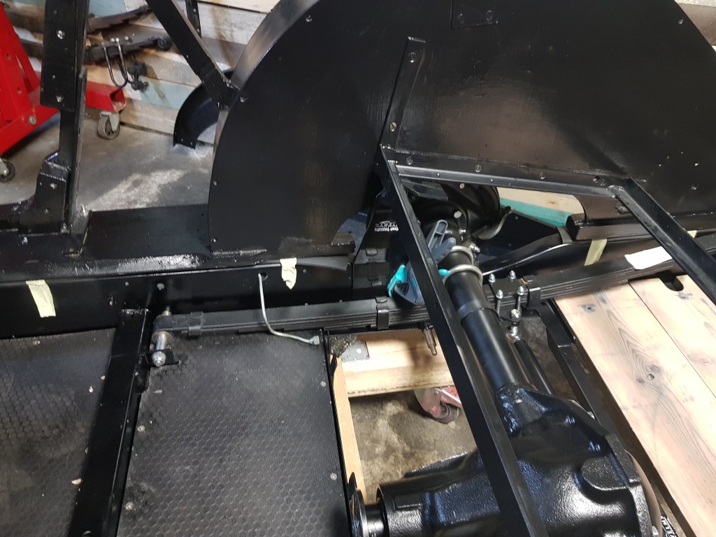 test to see if the bracket could be moved under the seat frame completely. This will result in a top compressed shock